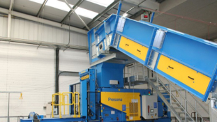 Heron Foods installs Presona baler and conveyor system.